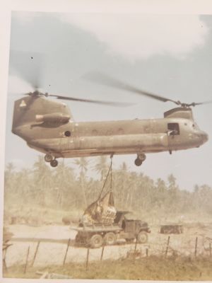 20230426_A421_CH47
Routine re-supply mission by CH47 Chinook. Palletized ammo being dropped into a 5 ton dump truck.  The camp got regularly resupplied with ammo, chow, and beer via CH47. This 5t dump truck later struck a hastily employed AT mine in a road after inserting a US SF/CIDG patrol at a nearby village; two US SF personnel were in the crew cab - neither was injured in the explosion, as only the rear wheels initiated the mine.
Keywords: A421 Resupply;CH47