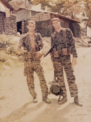 20230426_A421_John Meyer_John Aerts
SGTs John Meyer (Operations) and John Aerts (Weapons), prior to a mine sweep (note mine detector held by SGT Aerts) of the main approach road into Ba Xoai. Note Tiger fatigues - standard duty uniform; we never wore issue jungle fatigues while at camp.
Keywords: SGTs Meyer and Aerts, A421 Ba Xoai